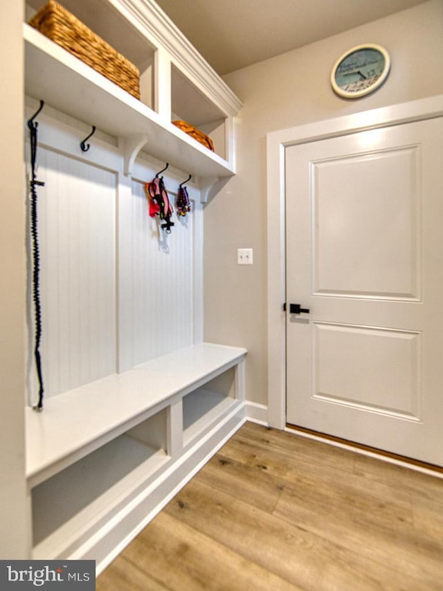 33016 Ethan Allen Dr, Rehoboth Beach, DE 19971 - mudroom featuring wood finished floors and baseboards