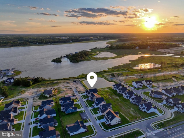 33016 Ethan Allen Dr, Rehoboth Beach, DE 19971 - aerial view at dusk of a water view and a residential view