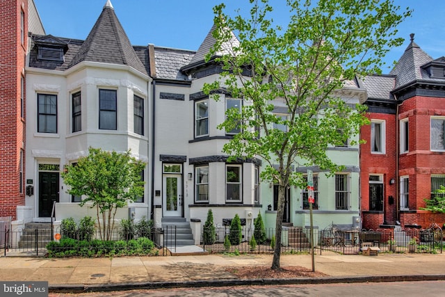 1713 4th St NW, Washington, DC 20001 - view of front of property with entry steps, a fenced front yard, and brick siding