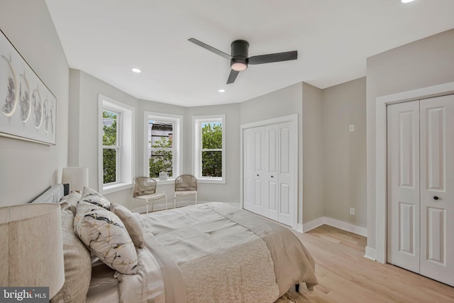 1713 4th St NW, Washington, DC 20001 - bedroom featuring two closets, baseboards, recessed lighting, light wood-style floors, and ceiling fan