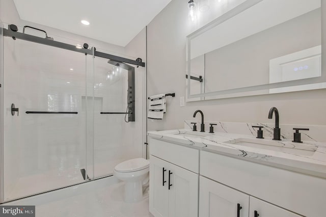 1713 4th St NW, Washington, DC 20001 - full bathroom featuring toilet, double vanity, a shower stall, and recessed lighting