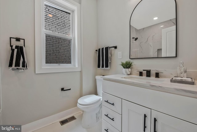 1713 4th St NW, Washington, DC 20001 - bathroom with vanity, toilet, baseboards, and a marble finish shower