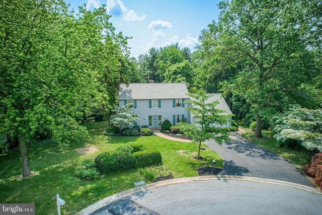 2640 Breezewood Dr, Lancaster, PA 17601 - colonial-style house featuring a front yard, a chimney, and driveway