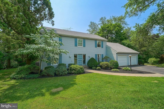 2640 Breezewood Dr, Lancaster, PA 17601 - colonial-style house featuring driveway, a front yard, and an attached garage