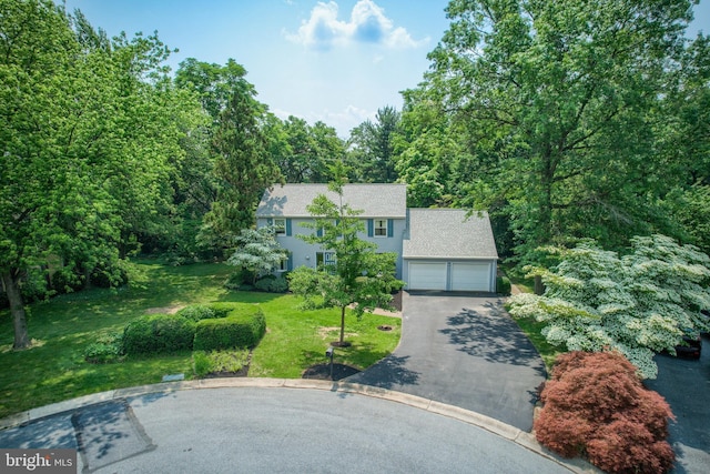 2640 Breezewood Dr, Lancaster, PA 17601 - colonial house featuring asphalt driveway, a front lawn, an attached garage, and a shingled roof