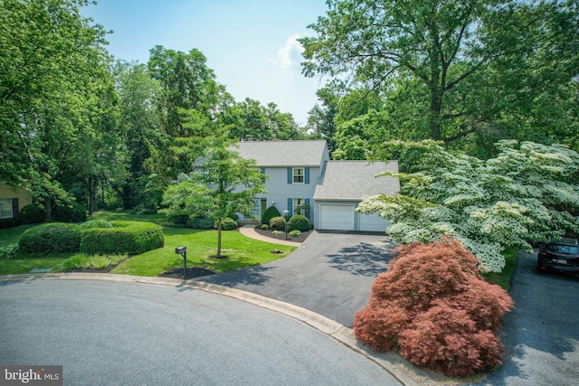 2640 Breezewood Dr, Lancaster, PA 17601 - colonial house with driveway, a garage, a front yard, and roof with shingles