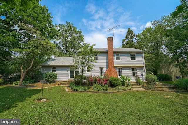 2640 Breezewood Dr, Lancaster, PA 17601 - rear view of property featuring a chimney and a lawn