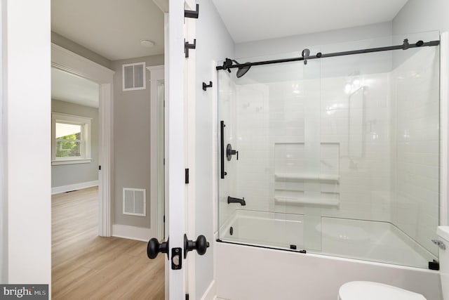 434 Bunker Hill Rd, Halifax, PA 17032 - full bathroom with combined bath / shower with glass door, wood finished floors, baseboards, and toilet