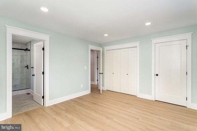 434 Bunker Hill Rd, Halifax, PA 17032 - unfurnished bedroom with light wood-style flooring, ensuite bath, recessed lighting, baseboards, and multiple closets