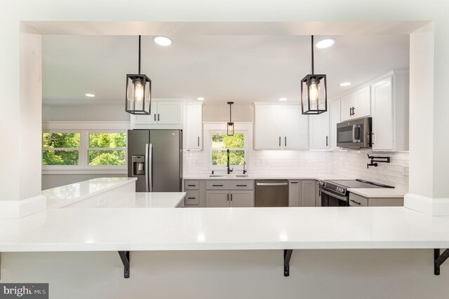 434 Bunker Hill Rd, Halifax, PA 17032 - kitchen with stainless steel appliances, a sink, a kitchen bar, plenty of natural light, and recessed lighting