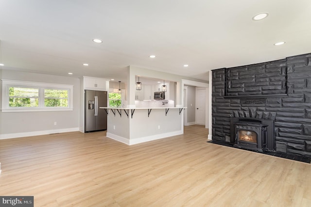 434 Bunker Hill Rd, Halifax, PA 17032 - unfurnished living room with baseboards, light wood finished floors, recessed lighting, and a fireplace with flush hearth