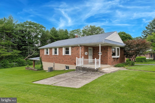 909 Rocklynn Rd, Springfield, PA 19064 - ranch-style home with brick siding, a front lawn, a chimney, and a shingled roof
