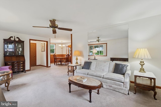 909 Rocklynn Rd, Springfield, PA 19064 - living room featuring a ceiling fan, carpet, and a chandelier