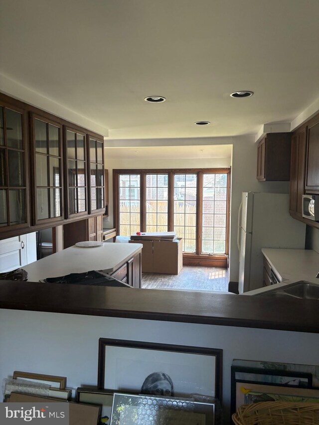 3210 Fernwood Pl, Wilmington, DE 19802 - kitchen with freestanding refrigerator, healthy amount of natural light, a sink, dark brown cabinetry, and recessed lighting