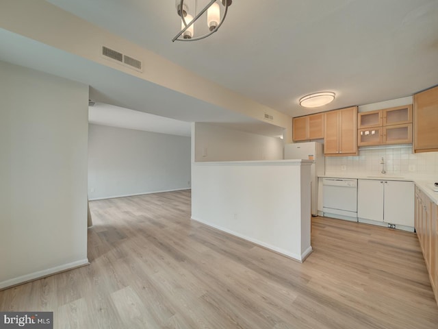 5017 7th Rd S Unit 101, Arlington, VA 22204 - kitchen with white appliances, a sink, tasteful backsplash, and light wood-type flooring