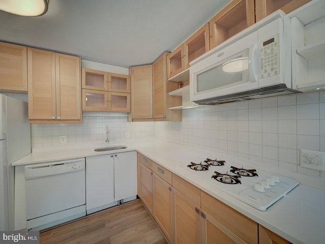 5017 7th Rd S Unit 101, Arlington, VA 22204 - kitchen featuring white appliances, open shelves, a sink, backsplash, and light countertops