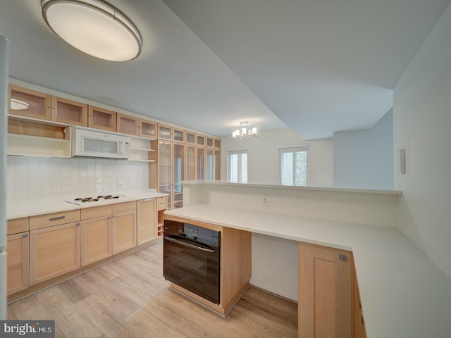 5017 7th Rd S Unit 101, Arlington, VA 22204 - kitchen with white appliances, open shelves, tasteful backsplash, light wood-style floors, and light brown cabinets