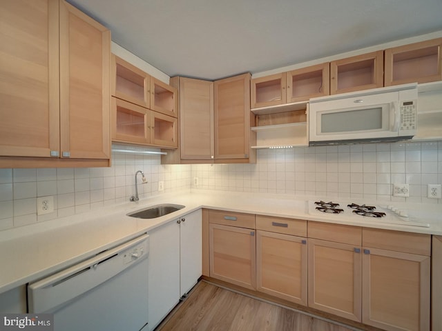 5017 7th Rd S Unit 101, Arlington, VA 22204 - kitchen featuring open shelves, white appliances, a sink, tasteful backsplash, and light countertops