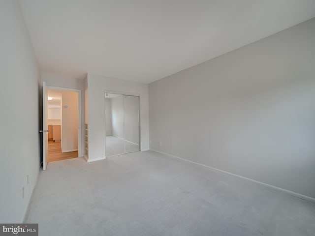 5017 7th Rd S Unit 101, Arlington, VA 22204 - unfurnished bedroom with a closet, light colored carpet, and baseboards