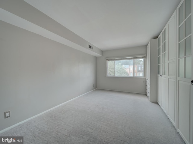 5017 7th Rd S Unit 101, Arlington, VA 22204 - unfurnished bedroom featuring light colored carpet and baseboards