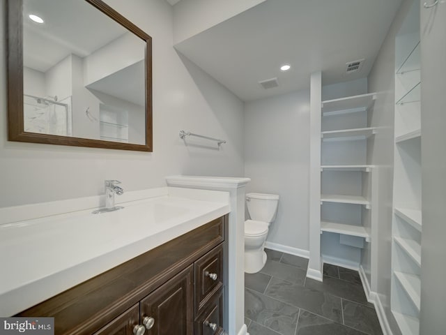 5017 7th Rd S Unit 101, Arlington, VA 22204 - bathroom featuring toilet, vanity, baseboards, marble finish flooring, and recessed lighting