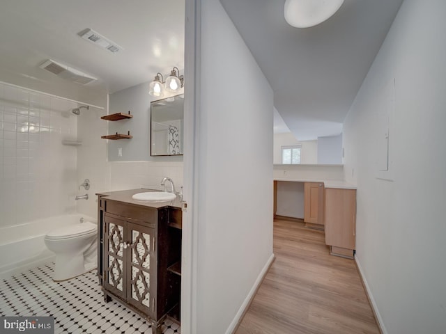 5017 7th Rd S Unit 101, Arlington, VA 22204 - bathroom with vanity, bathing tub / shower combination, toilet, and wood finished floors