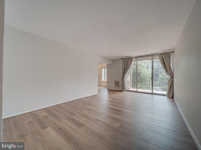 5017 7th Rd S Unit 101, Arlington, VA 22204 - spare room featuring wood finished floors and baseboards