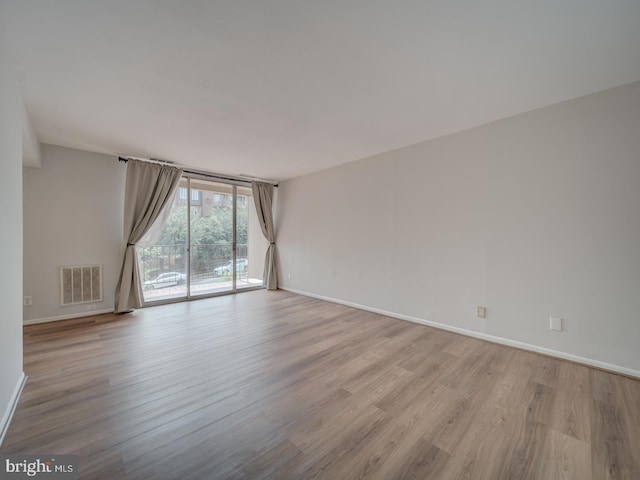 5017 7th Rd S Unit 101, Arlington, VA 22204 - unfurnished room featuring wood finished floors and baseboards
