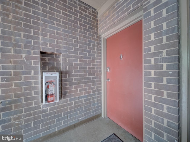 5017 7th Rd S Unit 101, Arlington, VA 22204 - view of exterior entry featuring brick siding