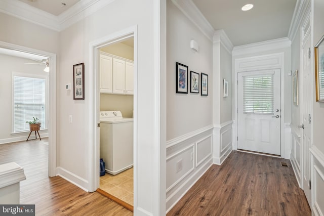 9 Brant Ct, Fredericksburg, VA 22406 - hallway featuring washer / clothes dryer, ornamental molding, and wood finished floors