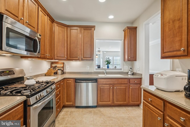 9 Brant Ct, Fredericksburg, VA 22406 - kitchen featuring stainless steel appliances, a sink, brown cabinetry, and recessed lighting
