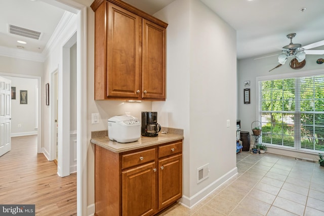 9 Brant Ct, Fredericksburg, VA 22406 - bar area featuring ceiling fan, ornamental molding, and baseboards