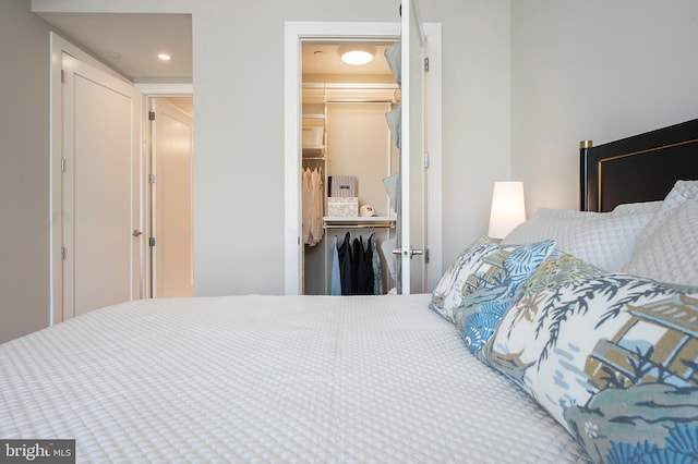 801 N Fairfax St Unit 314, Alexandria, VA 22314 - bedroom with a walk in closet, a closet, and recessed lighting