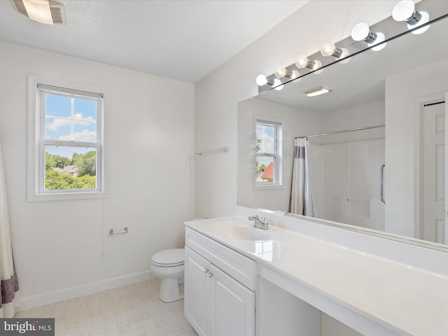 2 Assawoman Ave, Ocean View, DE 19970 - bathroom with plenty of natural light, vanity, curtained shower, and tile patterned floors