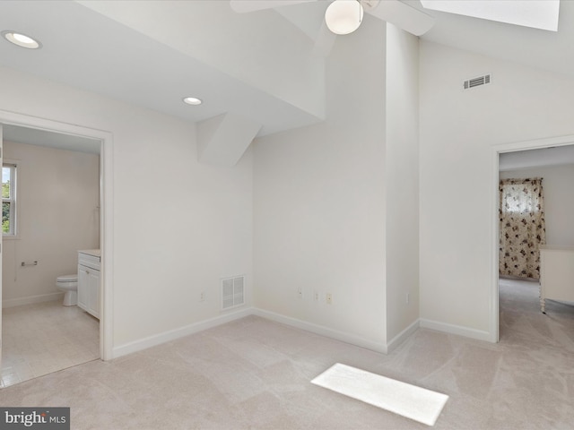 2 Assawoman Ave, Ocean View, DE 19970 - unfurnished bedroom featuring light colored carpet, recessed lighting, ensuite bathroom, a skylight, and a ceiling fan