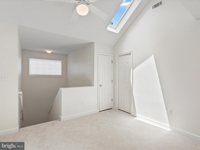 2 Assawoman Ave, Ocean View, DE 19970 - carpeted spare room with a ceiling fan, a skylight, and high vaulted ceiling