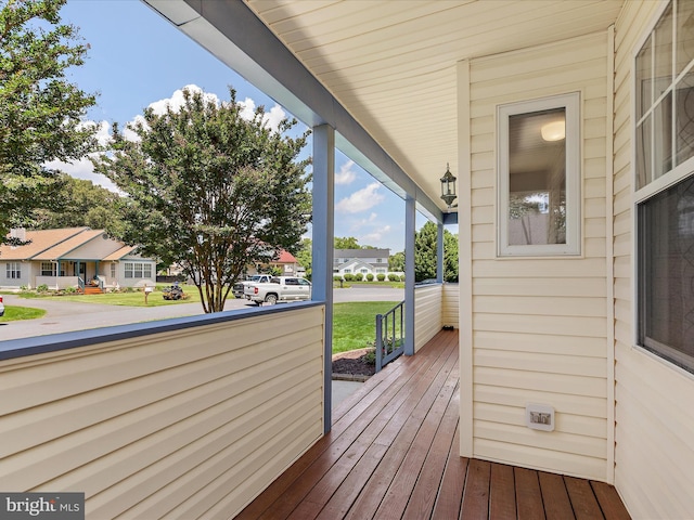 2 Assawoman Ave, Ocean View, DE 19970 - wooden porch featuring a residential view