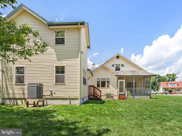 2 Assawoman Ave, Ocean View, DE 19970 - rear view of property featuring entry steps, a yard, and a sunroom