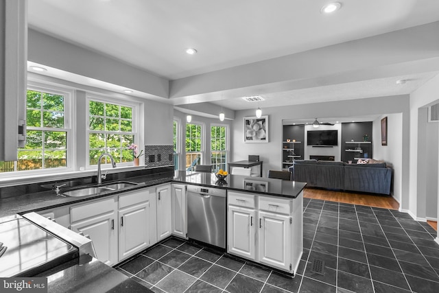 12407 Rousseau Ter, North Potomac, MD 20878 - kitchen with stainless steel dishwasher, dark tile patterned flooring, a peninsula, dark countertops, and white cabinetry