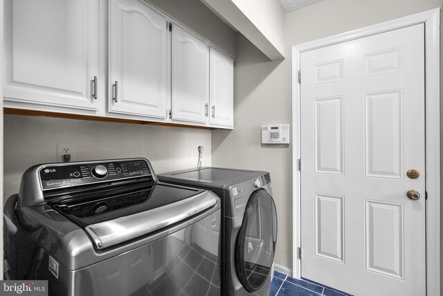12407 Rousseau Ter, North Potomac, MD 20878 - washroom with independent washer and dryer, cabinet space, and dark tile patterned floors