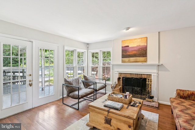 2085 Cobblestone Ln, Reston, VA 20191 - living area featuring wood finished floors and a fireplace