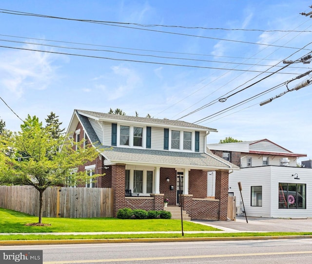 506 W High St, Carlisle, PA 17013 - view of front of property featuring brick siding and roof with shingles