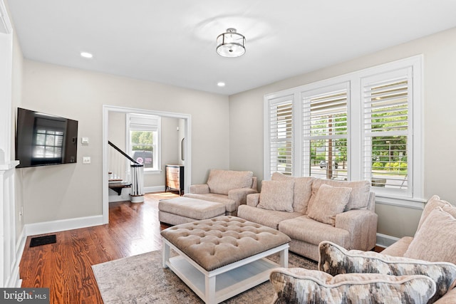 506 W High St, Carlisle, PA 17013 - living area featuring stairway, baseboards, and wood finished floors
