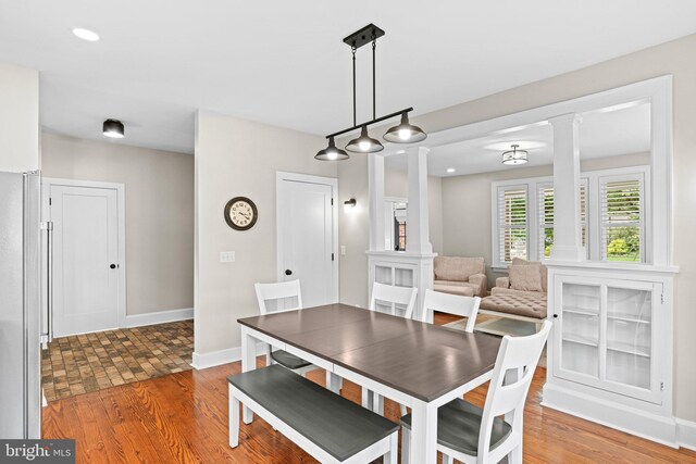506 W High St, Carlisle, PA 17013 - dining room with ornate columns, wood finished floors, baseboards, and recessed lighting