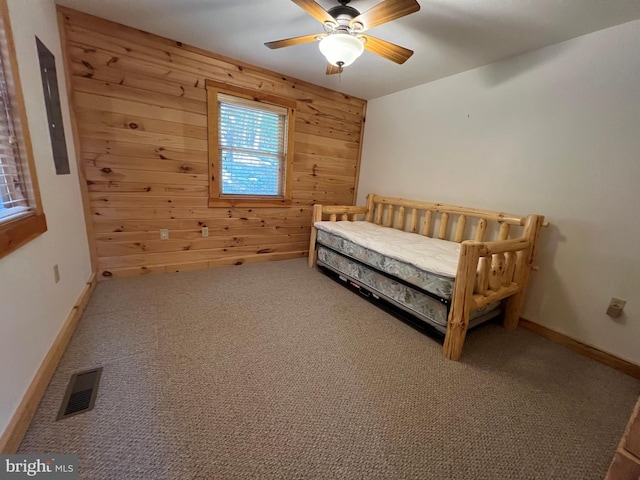 1000 Cardinal View Rd, Paw Paw, WV 25434 - bedroom featuring wooden walls, carpet, electric panel, and a ceiling fan