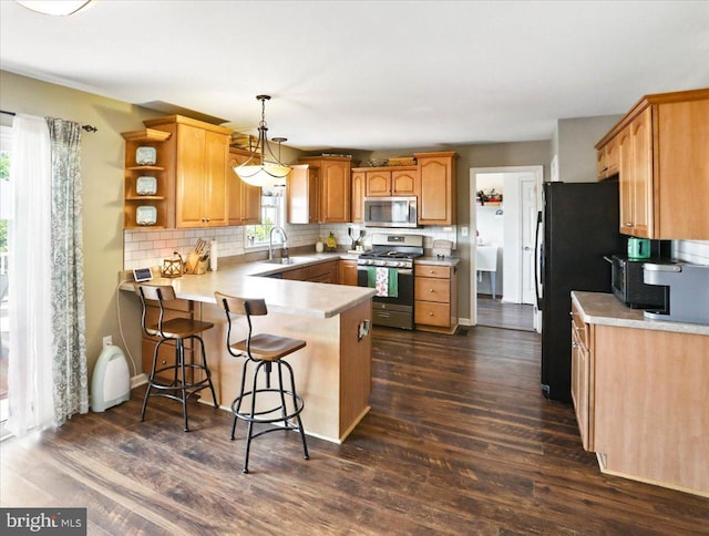 17 Shelly Dr, Reading, PA 19608 - kitchen with stainless steel appliances, a peninsula, a sink, tasteful backsplash, and dark wood finished floors