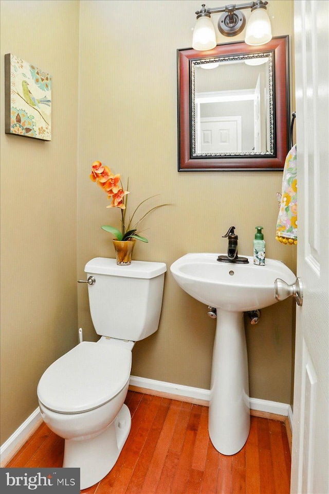 17 Shelly Dr, Reading, PA 19608 - half bathroom with wood finished floors, toilet, and baseboards