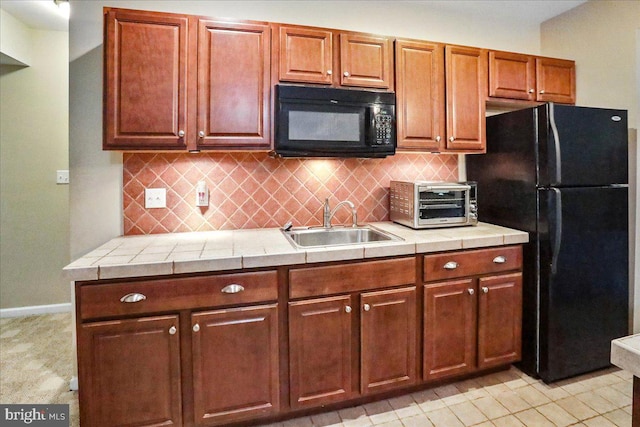 17 Shelly Dr, Reading, PA 19608 - kitchen featuring black appliances, a sink, tasteful backsplash, and baseboards