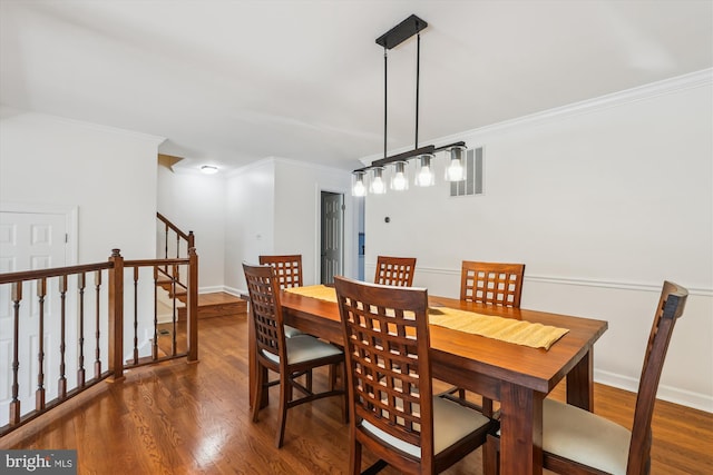 4410 S Pershing Ct, Arlington, VA 22204 - dining room with crown molding, dark wood finished floors, and baseboards