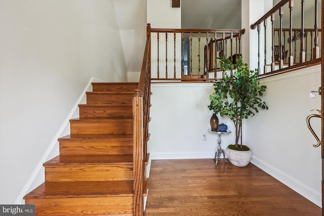 4410 S Pershing Ct, Arlington, VA 22204 - staircase featuring wood finished floors and baseboards